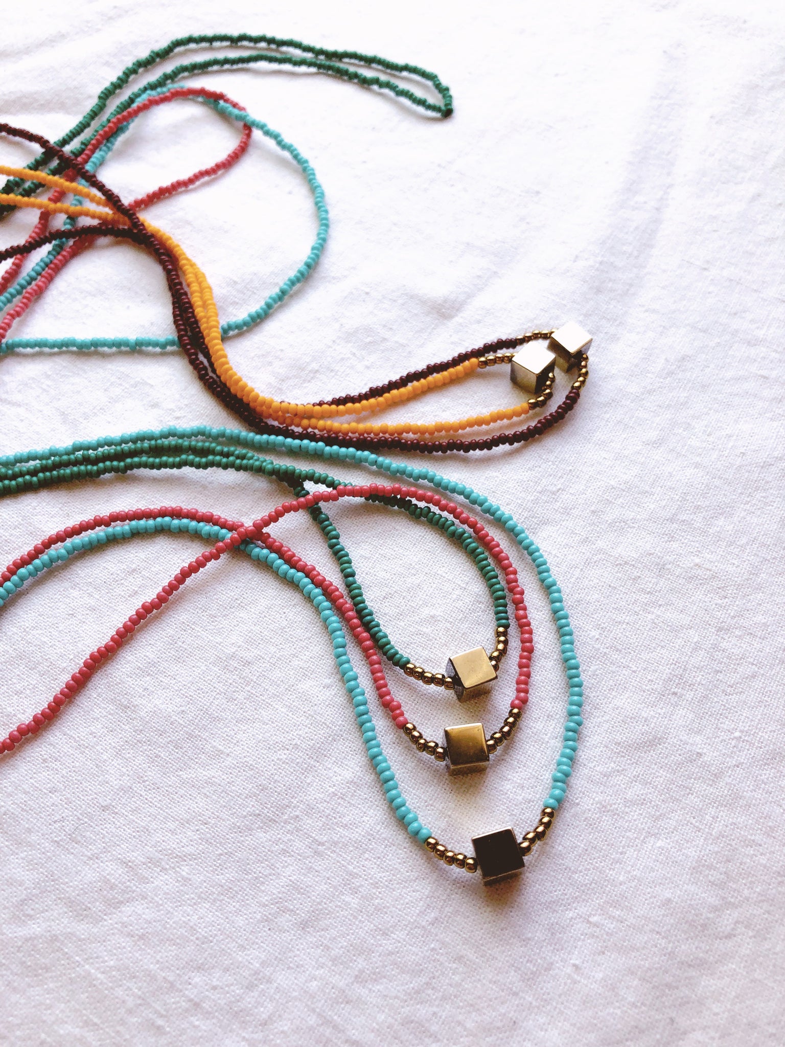 Festival Parade + Minimalist Pyrite and Vintage glass beaded necklaces